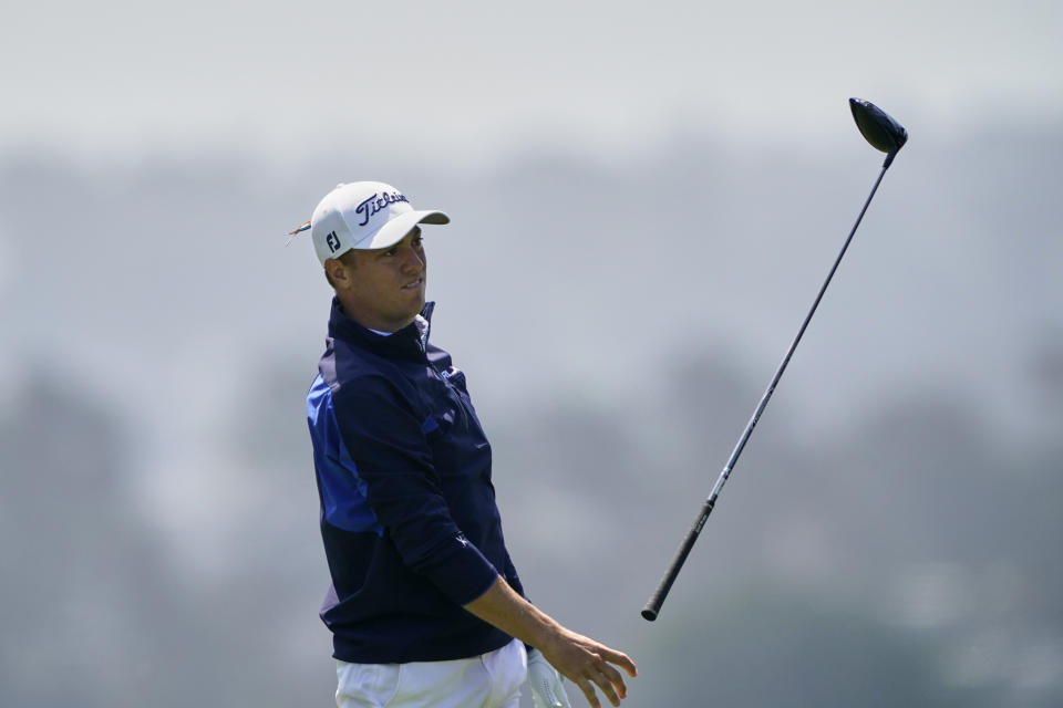 Justin Thomas tosses his driver on the 16th hole during the third round of the PGA Championship golf tournament at TPC Harding Park Saturday, Aug. 8, 2020, in San Francisco. (AP Photo/Charlie Riedel)