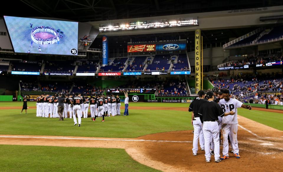 <p>Miami Marlins players all wearing jerseys bearing the number 16 and name Fernandez honor the late Jose Fernandez after the game against the New York Mets at Marlins Park on September 26, 2016 in Miami, Florida. (Photo by Rob Foldy/Getty Images) </p>