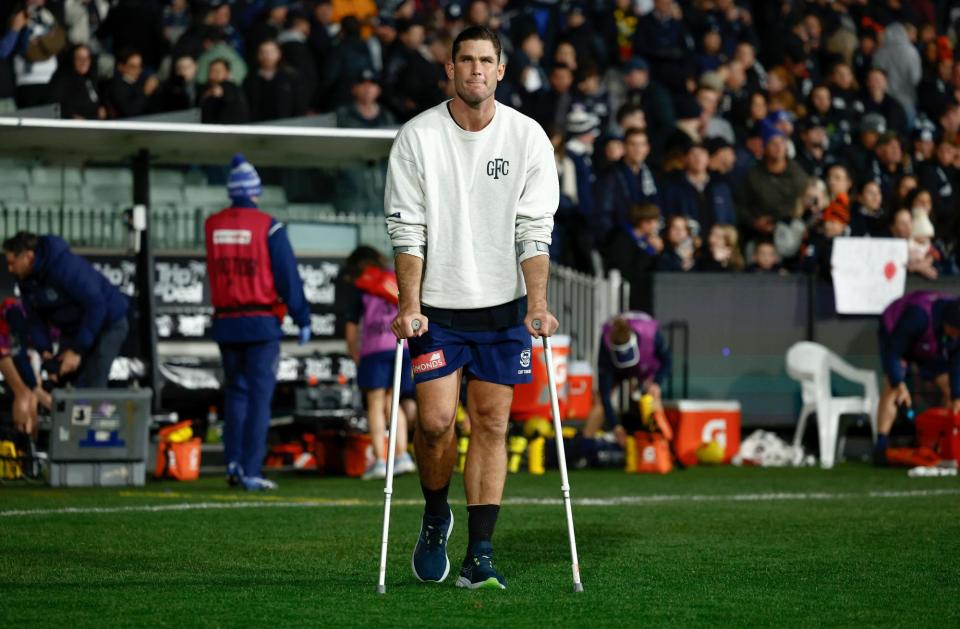 <span>Geelong’s Tom Hawkins is seen on crutches after the round 15 match against Carlton on the weekend.</span><span>Photograph: Michael Willson/AFL Photos/Getty Images</span>