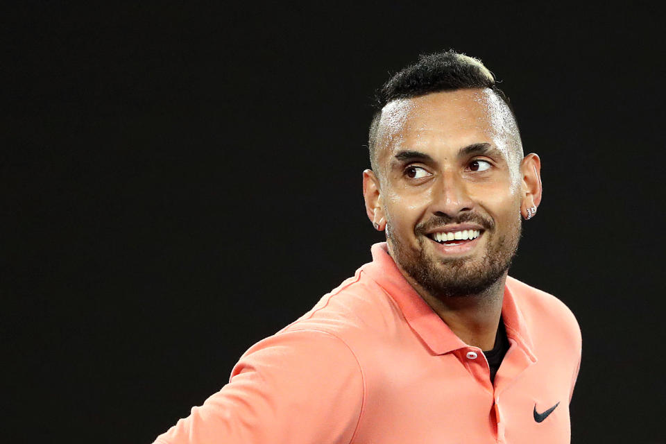 Nick Kyrgios smiles during the 2020 Australian Open.