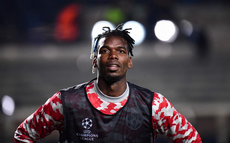 Manchester United's France's midfielder Paul Pogba warming up ahead of the UEFA Champions League group F football match between Atalanta and Manchester United - AFP