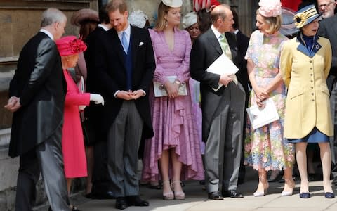 Prince Harry talks to the Queen at today's royal wedding - Credit: Getty