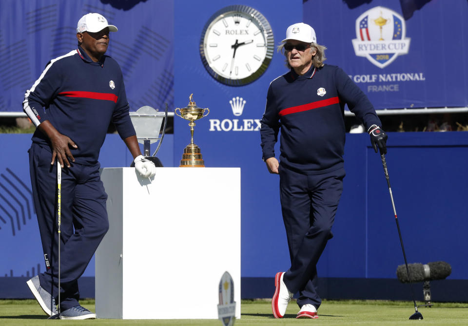 Actors Samuel L Jackson, left, and Kurt Russell of the US stand on the 1st tee before starting the Ryder Cup Celebrity Challenge match at Le Golf National in Saint-Quentin-en-Yvelines, outside Paris, France, Tuesday, Sept. 25, 2018. The 42nd Ryder Cup will be held in France from Sept. 28-30, 2018 at Le Golf National. (AP Photo/Alastair Grant)