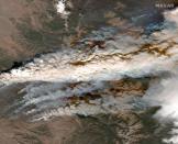 Maxar satellite image shows smoke from the East Troublesome wildfires at Grand Lake in Colorado