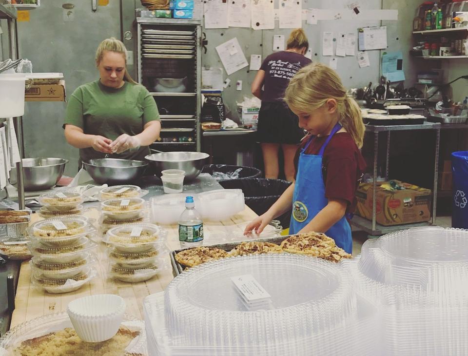 The team at Clove Brook Market prepares pies.