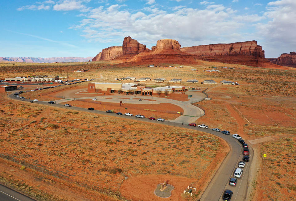 Vehicles line up for testing outside of the Monument Valley Health Center in Oljato-Monument Valley, Utah, on Apr. 17, 2020. | Kristin Murphy/The Deseret News–AP