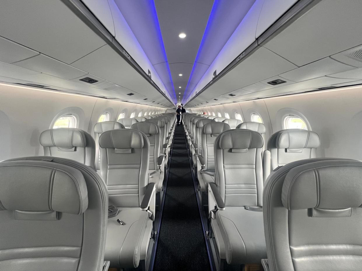 A view down the aisle of an Embraer E195-E2 at the 2024 Farnborough Airshow