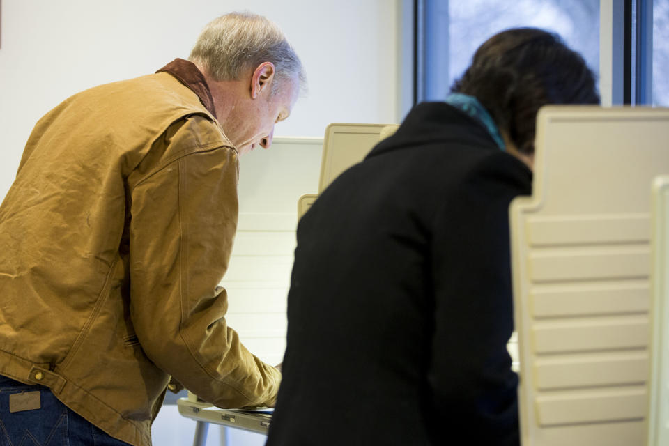 Illinois Republican gubernatorial candidate Bruce Rauner, left, and his wife, Diana Rauner, vote on Tuesday, March 18, 2014, in Winnetka, Ill. Rauner faces State Sen. Bill Brady, State Sen. Kirk Dillard and State Treasurer Dan Rutherford in the primary election. (AP Photo/Andrew A. Nelles)