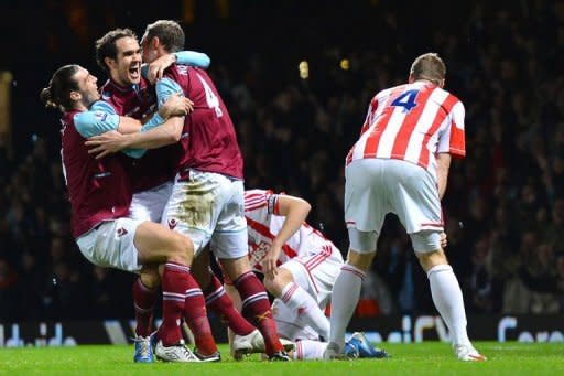 West Ham United's Irish defender Joey O'Brien (2nd L) celebrates after scoring a goal during the English Premier League football match between West Ham and Stoke City at the Boleyn Ground, Upton Park, in East London, England. The match ended in a 1-1 draw
