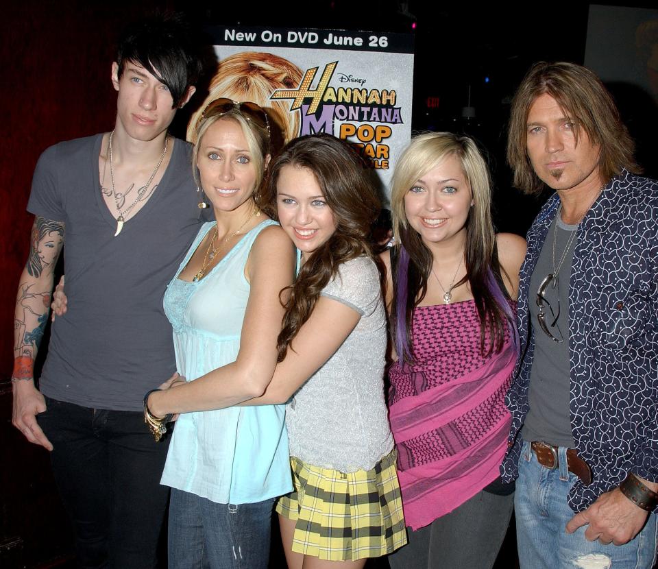 Tish, Miley, Brandi, Billy Rae, and Trace at a media event