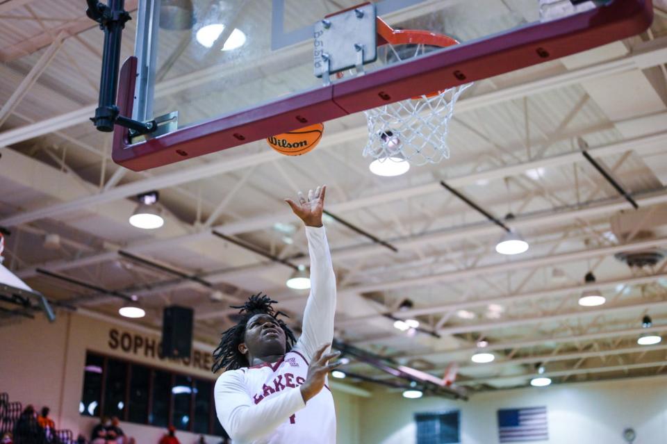 Palm Beach Lakes guard Zach Brown (14) goes for a layup during the second half of the basketball game between Suncoast and host Palm Beach Lakes in West Palm Beach, FL, on Saturday, January 9, 2022. Final score, Palm Beach Lakes, 52, Suncoast, 51.