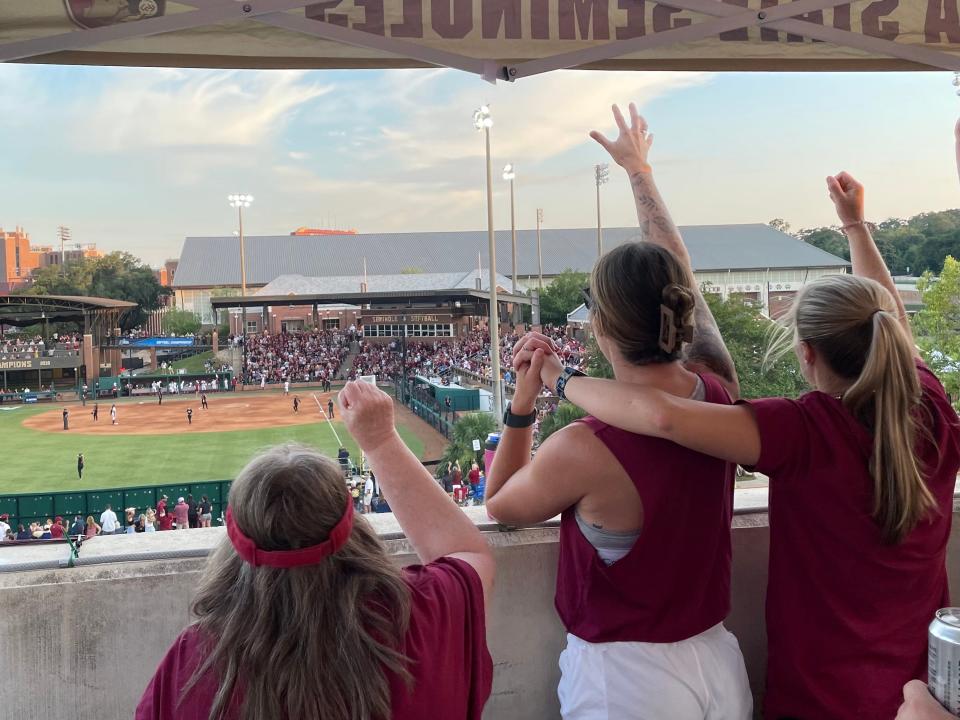 Florida State fans celebrate a score Thursday from the fourth floor of the Spirit Way Parking Garage.