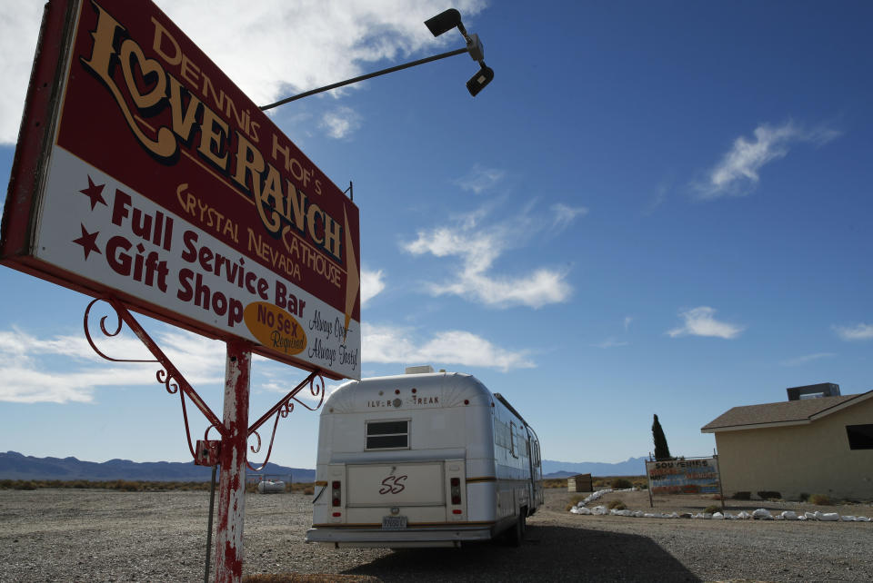 File - In this Oct. 16, 2018, file photo, a sign advertises the Love Ranch brothel in Pahrump, Nev. A federal judge in Nevada has dismissed a lawsuit that invoked sex trafficking laws in a bid to close the nation's only legal brothels. U.S. District Judge Miranda Du in Reno cited jurisdictional grounds, after saying in her Tuesday, Oct. 29, 2019, ruling that she empathizes with the three women who claim they were sexual violence victims in Nevada and other states. The women live in Texas, and the judge says she's not convinced the profound harm they say they suffered was due to Nevada prostitution laws. (AP Photo/John Locher, File)