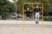 People, wearing protective face masks exercise at Carabanchel neighbourhood in Madrid