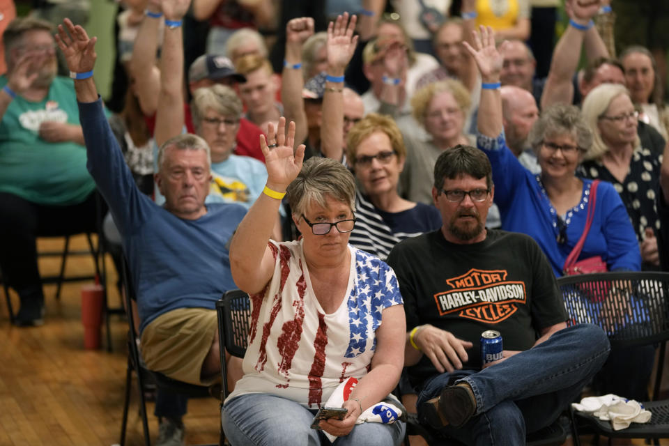 Audience members react as they listen to Independent presidential candidate Robert F. Kennedy Jr. speak during a campaign event, Saturday, April 13, 2024, in West Des Moines, Iowa. (AP Photo/Charlie Neibergall)