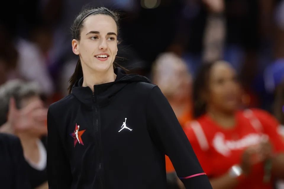 PHOENIX, ARIZONA - JULY 20: Caitlin Clark #22 of Team WNBA looks on before the 2024 WNBA All-Star game against the USA Basketball Women's National Team at Footprint Center on July 20, 2024 in Phoenix, Arizona. NOTE TO USER: User expressly acknowledges and agrees that, by downloading and or using this photograph, User is consenting to the terms and conditions of the Getty Images License Agreement. (Photo by Alex Slitz/Getty Images)