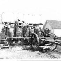 Here is a picture of a loading potato sprayer on the farm of Thomas B. Buell in Elmira in 1928. A team of mules would pull this rig through the rows of potatoes.