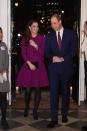 <p>Kate wears a purple Oscar de la Renta ensemble with black tights, pumps, and clutch to the Guild of Health Writers Conference with Prince William.</p>