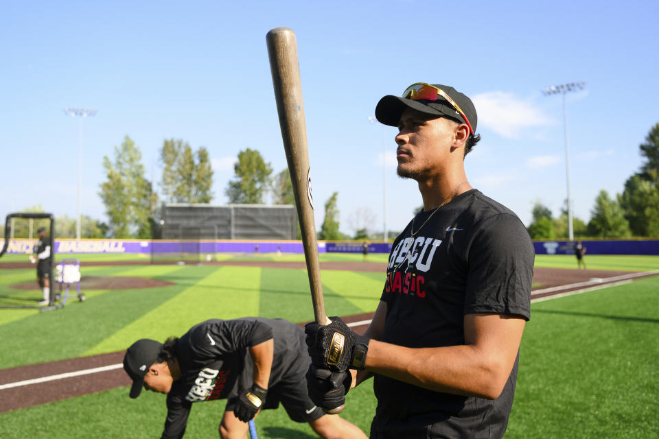 Norfolk State University's Manny Jackson looks at his bat during a workout the day before the HBCU Swingman Classic during the 2023 All Star Week, Thursday, July 6, 2023, in Seattle. (AP Photo/Caean Couto)