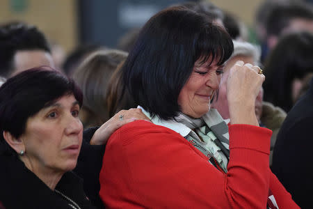 A member of the staff reacts during a ceremony at Brussels Zaventem airport, commemorating the second anniversary of twin attacks at Brussels airport and a metro train in Brussels, Belgium March 22, 2018. REUTERS/Eric Vidal