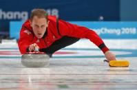 Curling - Pyeongchang 2018 Winter Olympics - Men's Round Robin - Britain v U.S. - Gangneung Curling Center - Gangneung, South Korea - February 21, 2018 - Kyle Smith of Britain delivers a stone. REUTERS/Phil Noble