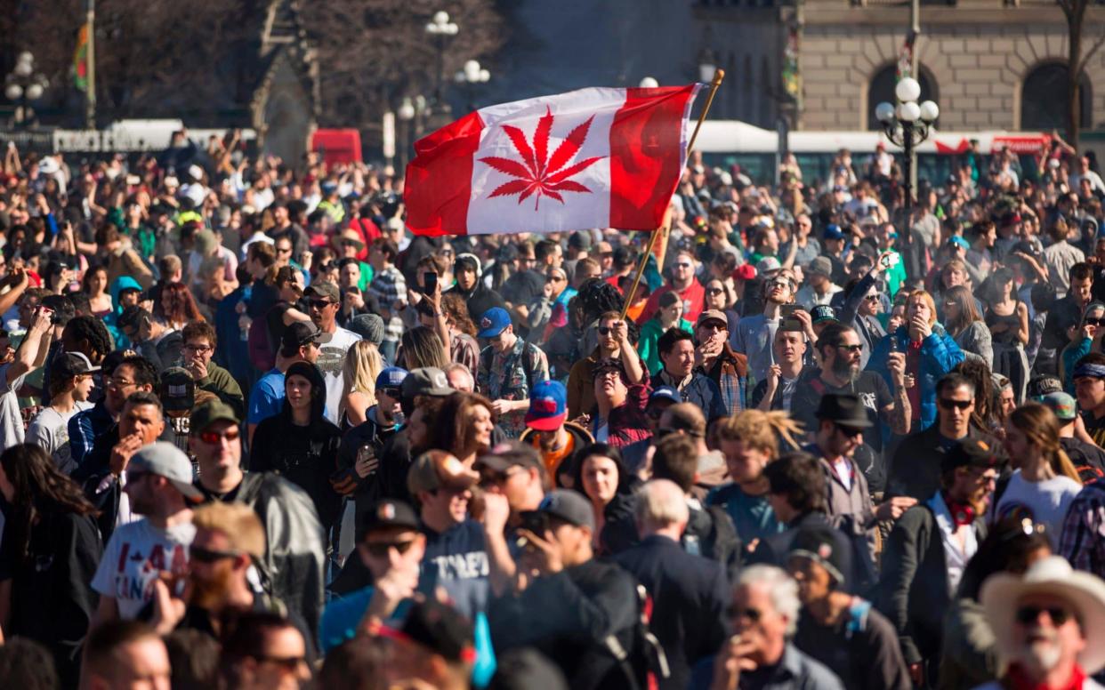 A rally to celebrate National Marijuana Day on Parliament Hill in Ottawa last year - AFP