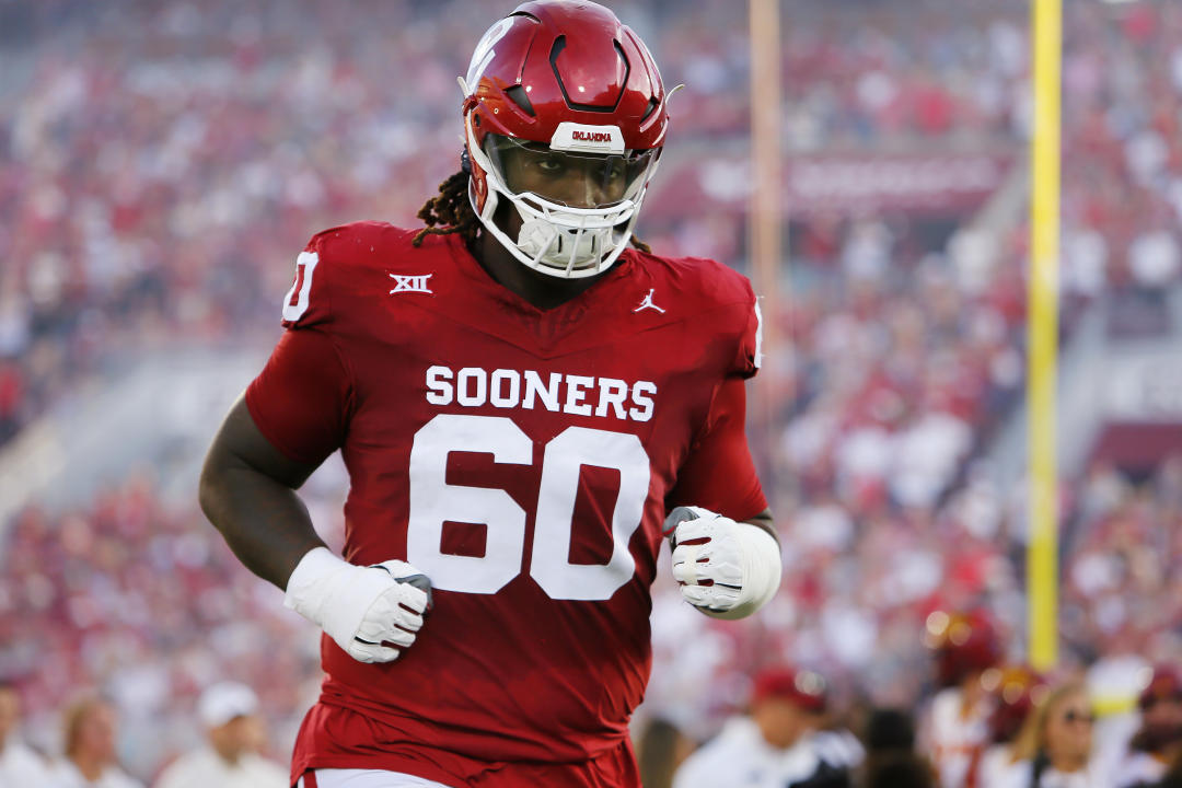 NORMAN, OKLAHOMA - SEPTEMBER 30: Right tackle Tyler Guyton #60 of the Oklahoma Sooners runs onto the field for a game against the Iowa State Cyclones at Gaylord Family Oklahoma Memorial Stadium on September 30, 2023 in Norman, Oklahoma. Oklahoma won 50-20. (Photo by Brian Bahr/Getty Images)