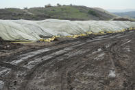 Compost piles are cured at the Otay Landfill in Chula Vista, Calif., on Friday, Jan. 26, 2024. Two years after California launched an effort to keep organic waste out of landfills, the state is so far behind on getting food recycling programs up and running that it's widely accepted next year's ambitious waste-reduction targets won't be met. (AP Photo/Damian Dovarganes)