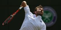 Switzerland's Stan Wawrinka serves against Spain's Fernando Verdasco in their third-round match at Wimbledon on July 3, 2015