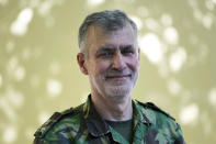 Rear Admiral Henrique Gouveia e Melo poses for a portrait outside a vaccination center in Lisbon, Tuesday, Sept. 21, 2021. As Portugal nears its goal of fully vaccinating 85% of the population against COVID-19 in nine months, other countries want to know how it was able to accomplish the feat. A lot of the credit is going to Gouveia e Melo. (AP Photo/Armando Franca)