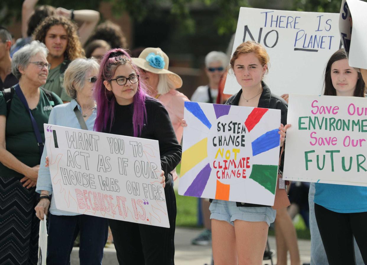 Izabella Kuwitzky and Erin Desens join climate change protesters during a 2019 Global Climate Strike in Appleton.