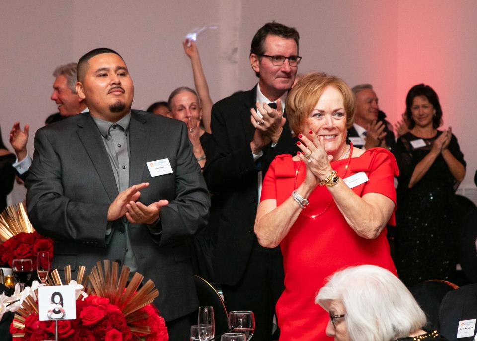 Immokalee Foundation alum and event speaker Julio Estrella and Louise Penta.