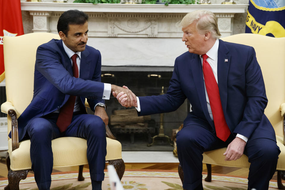 President Donald Trump shakes hands with Qatar's Emir Sheikh Tamim Bin Hamad Al-Thani in the Oval Office of the White House, Tuesday, July 9, 2019, in Washington. (AP Photo/Evan Vucci)