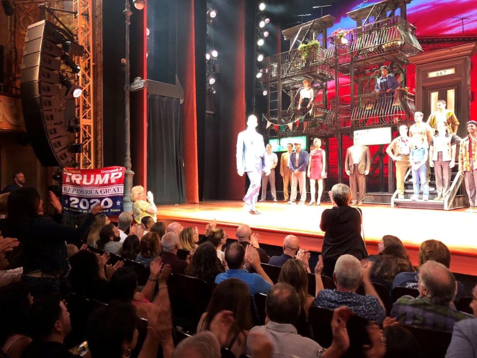 As the cast from "A Bronx Tale" took the curtain call, an audience member raised the banner.