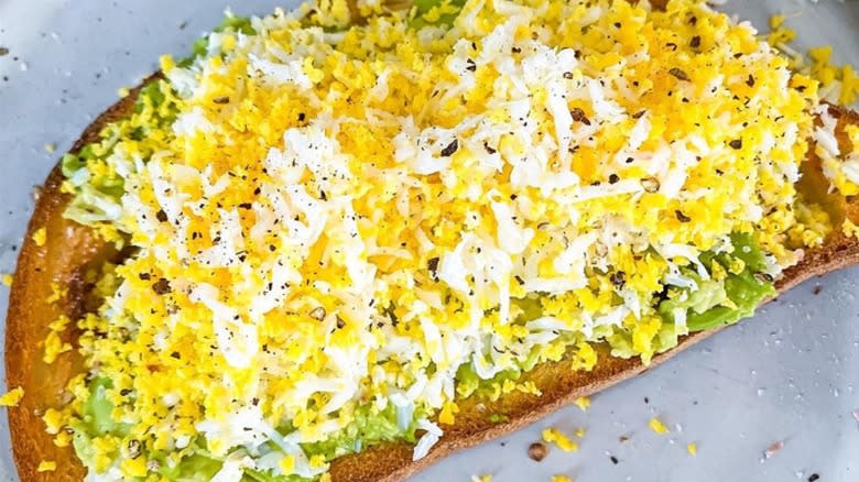 grated egg on avocado toast 