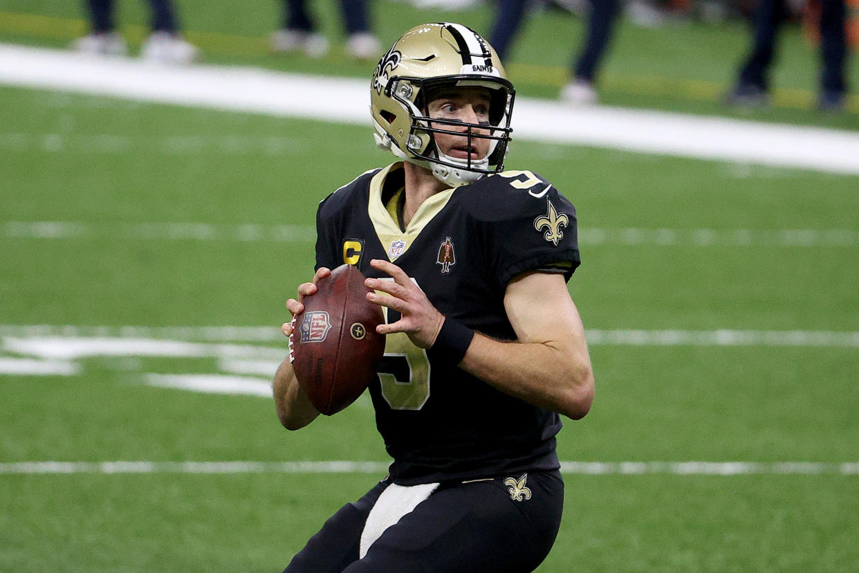 NEW ORLEANS, LOUISIANA - JANUARY 10: Drew Brees #9 of the New Orleans Saints looks to throw a pass against the Chicago Bears during the fourth quarter in the NFC Wild Card Playoff game at Mercedes Benz Superdome on January 10, 2021 in New Orleans, Louisiana. (Photo by Chris Graythen/Getty Images)