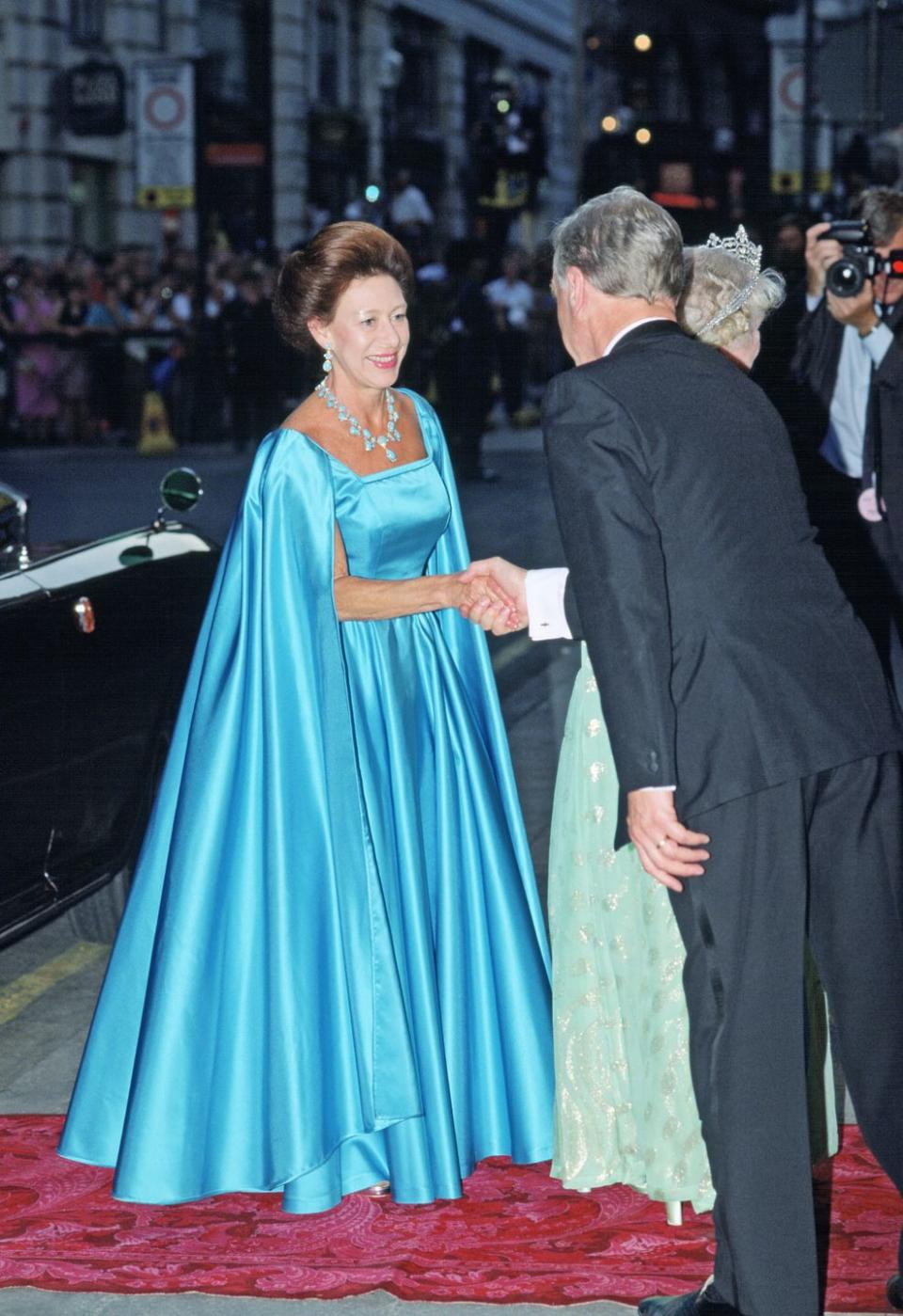 <p>In the summer of 1990, Princess Margaret was on hand to celebrate the Queen Mother's 90th birthday at the London Palladium. She wore this icy-blue number for the occasion, along with a blue necklace and earrings. </p>