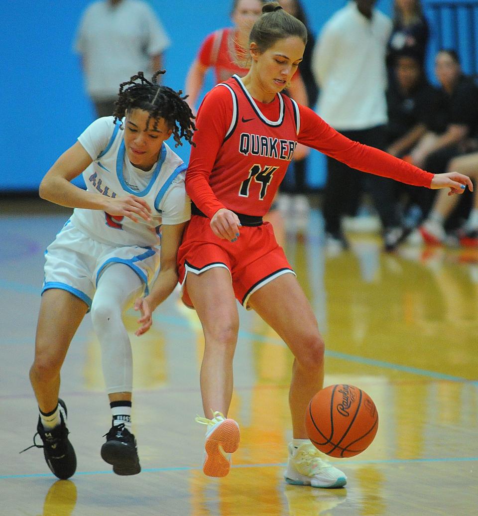 Alliance's Mar'Zae Gantz battles Salem's Abbie Davidson for a loose ball during an Eastern Buckeye Conference game at Alliance High School Wednesday, November 30, 2022.