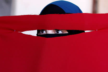 Alaa, 21, a student of health and nutrition, born in Copenhagen and wearer of the niqab, tests a face veil she created with members of the group Kvinder I Dialog (Women In Dialogue) during a workshop in preparation for a protest against the face veil ban in Copenhagen, Denmark, July 16, 2018. REUTERS/Andrew Kelly