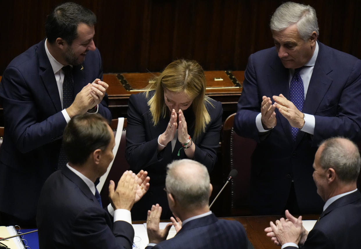 Italian Premier Giorgia Meloni, center, acknowledges the applause after addressing the lower Chamber ahead of a confidence vote for her Cabinet, Tuesday, Oct. 25, 2022. (Alessandra Tarantino/AP)