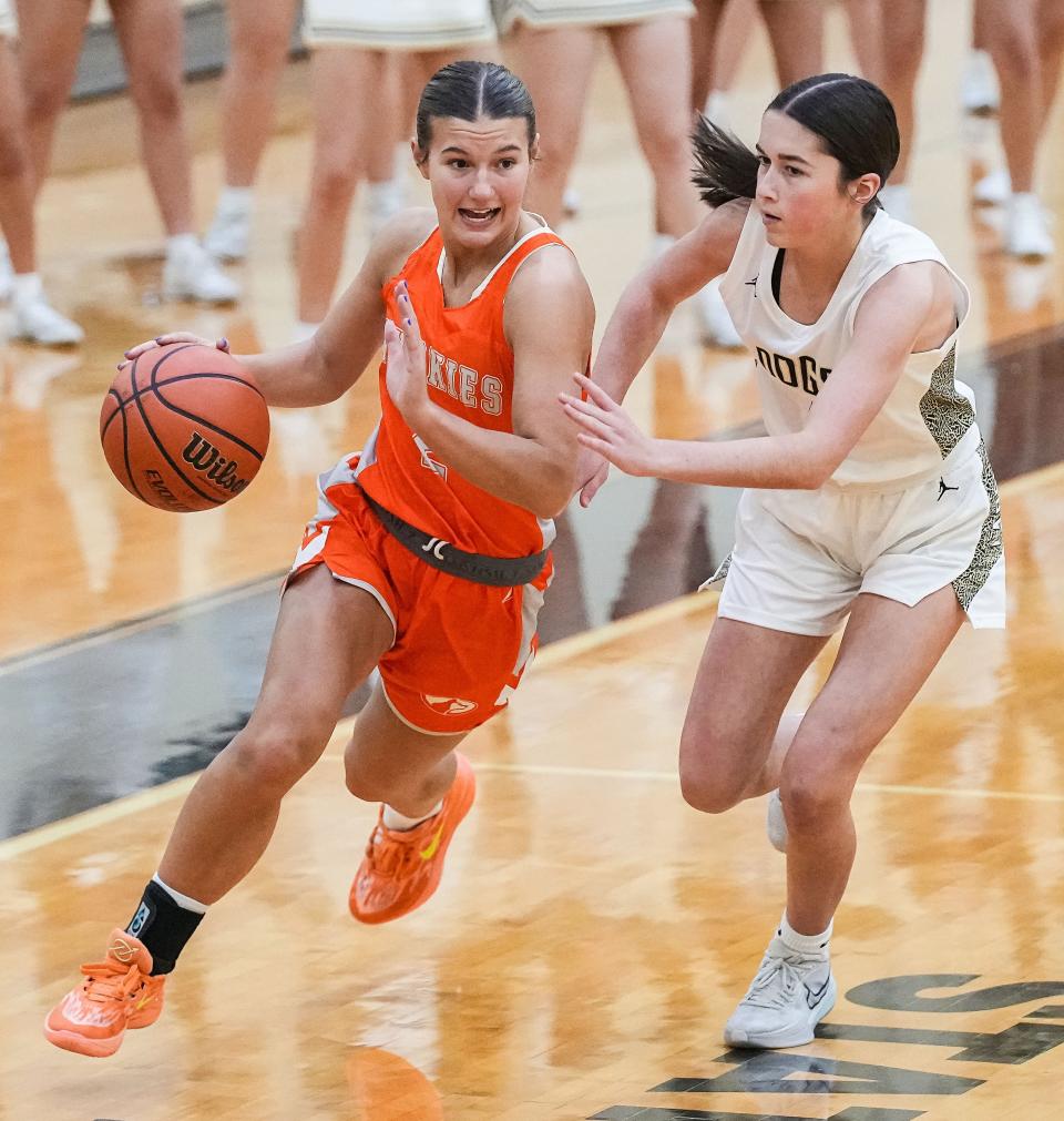 Hamilton Heights Huskies Ella Hickok (2) rushes up the court against Lapel Bulldogs Sophie Goodwin (1) on Tuesday, Dec. 19, 2023, during the game at Lapel High School in Lapel. The Hamilton Heights Huskies defeated the Lapel Bulldogs, 53-41.