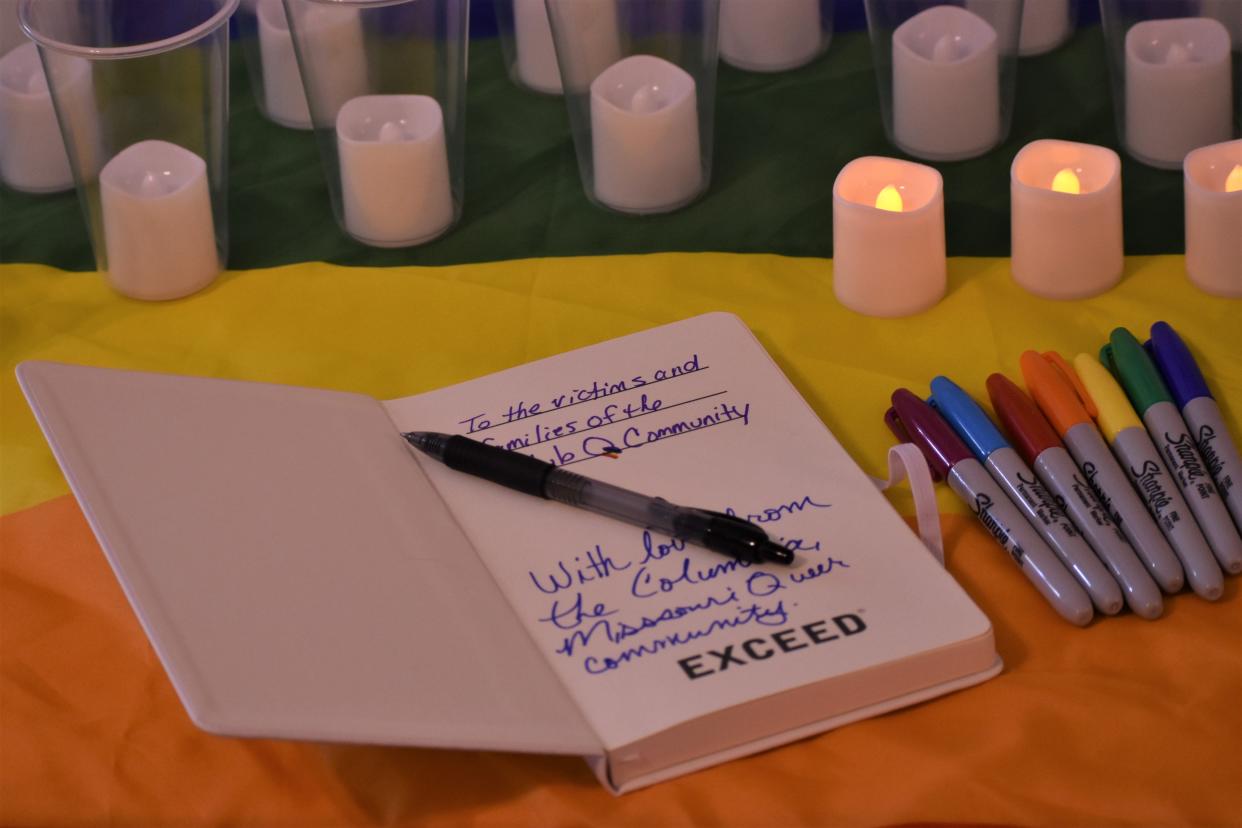 A guest book for vigil attendees to send their thoughts to the victims and families of the shooting at the Club Q nightclub lies on a table on Nov. 22, 2022, at the Center Project house in Columbia, Mo.