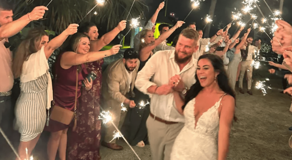 Samantha Miller and Aric Hutchinson at their wedding. (via GoFundMe)