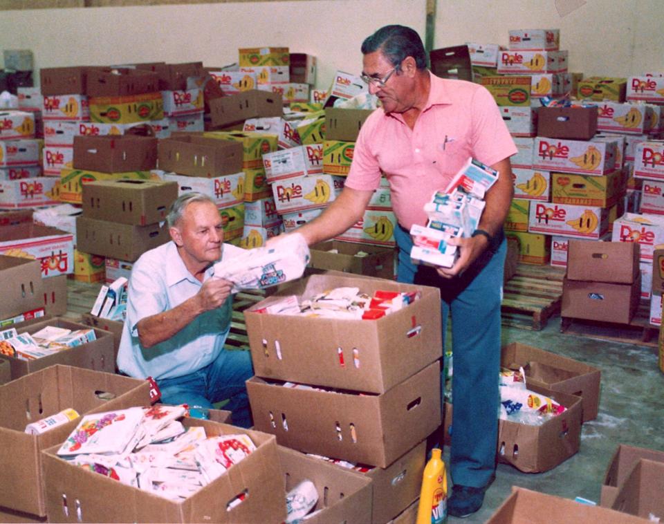 Ralph Reed (left) and J.V. Gilbreath unload boxes of food at Food Bank of Abilene.