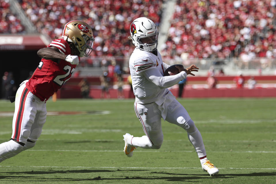 Arizona Cardinals quarterback Kyler Murray, right, runs against San Francisco 49ers cornerback Isaac Yiadom during the first half of an NFL football game in Santa Clara, Calif., Sunday, Oct. 6, 2024. (AP Photo/Jed Jacobsohn)