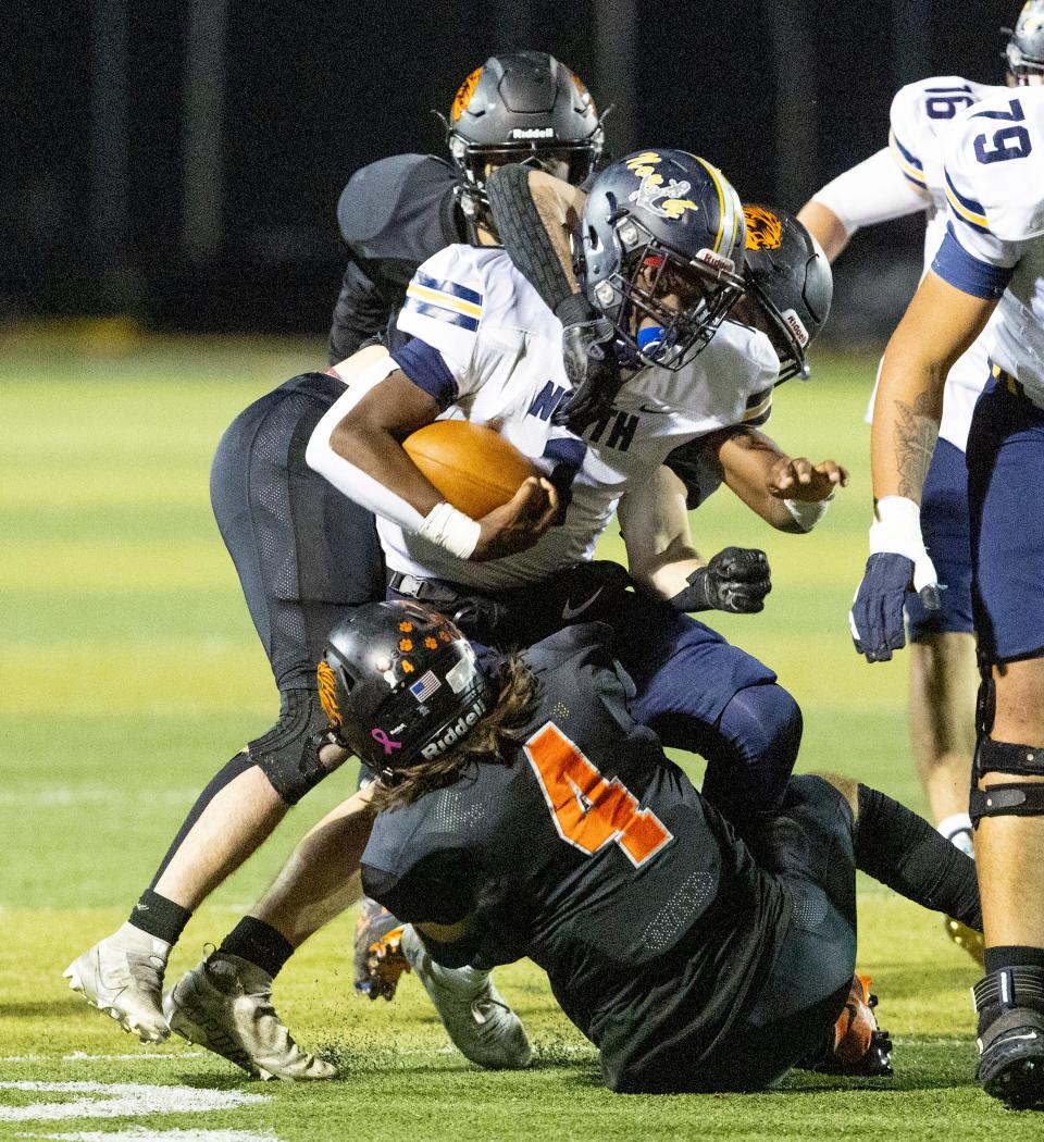 Toms River North's Micah Ford runs for yardage in the Mariners' 50-6 win over Middletown North Friday night.