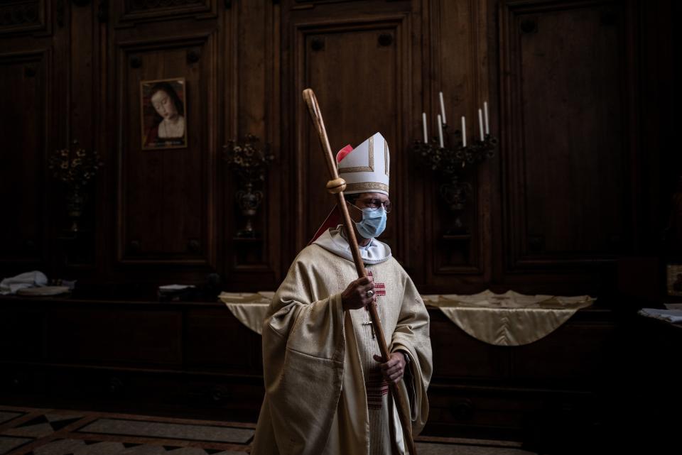 French bishop Monsignor Emmanuel Gobilliard wearing a protective face mask, prepares to lead the first mass in the Lyon Saint-Jean cathedral since the beginning of the lock down due to Covid 19 pandemic, on May 23, 2020. - France went into lockdown on March 17, to curb the spread of COVID-19. (Photo by JEFF PACHOUD / AFP) (Photo by JEFF PACHOUD/AFP via Getty Images)