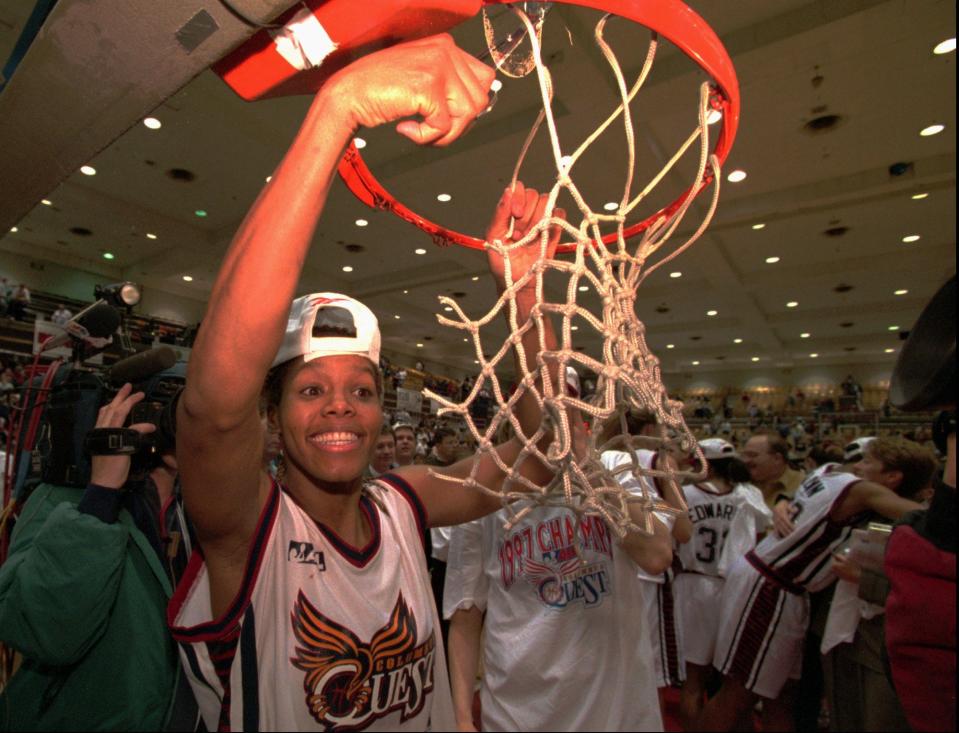 Columbus Quest's Nikki McCray, ABL's Player of the Year, celebrates their 77-64 victory over the Richmond Rage in the championship game by cutting down the net in Columbus, Ohio, Tuesday, March 11, 1997. (AP Photo/John Victor)