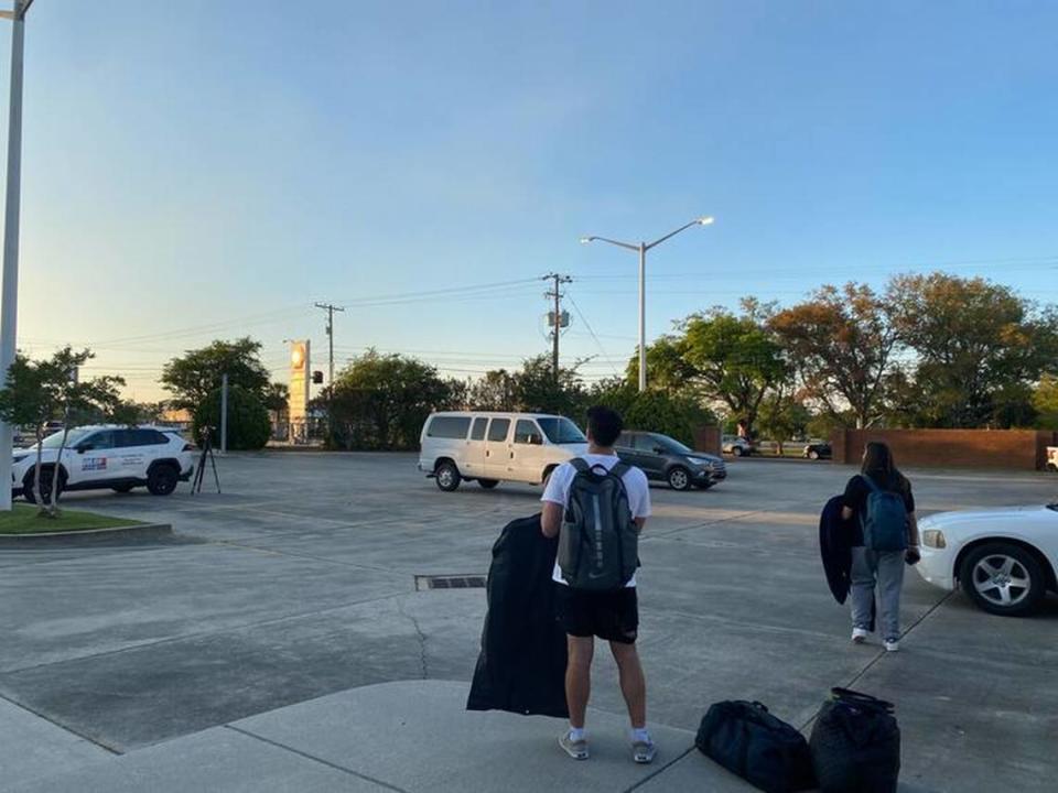 Students involved in a bus crash Friday on Interstate 10 in Hancock County waited for rideshare services to New Orleans at the Municipal Court in Bay St. Louis. Martha Sanchez/Sun Herald