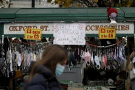 FILE - In this Dec. 2, 2020 file photo face masks to curb the spread of coronavirus are displayed for sale on a stall as non-essential shops are allowed to reopen after England's second lockdown ended at midnight, on Oxford Street, in London. (AP Photo/Matt Dunham, File)